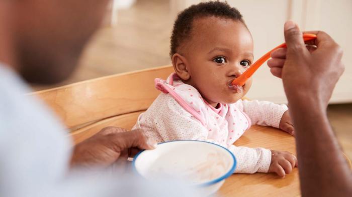 Feeding parents baby stock